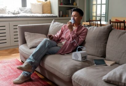 full-shot-man-using-nebulizer-home_23-2150562056