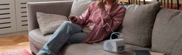 full-shot-man-using-nebulizer-home_23-2150562056